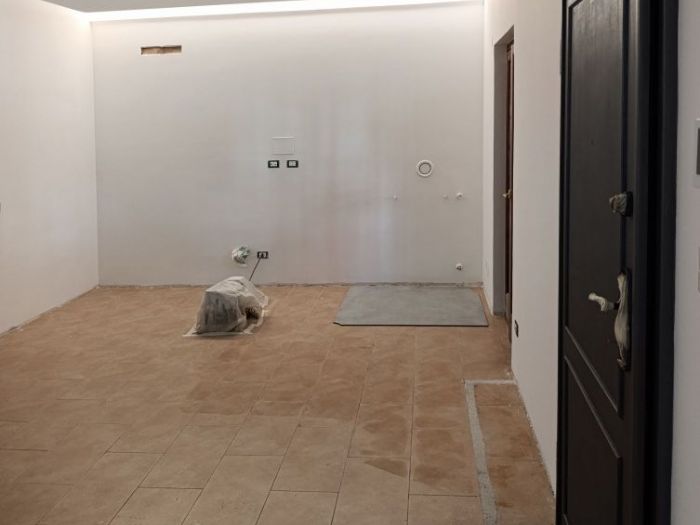 Archisio - Mani Srl Ristrutturazini - Progetto Ristrutturazione salone con parete attrezzata roma Zona axa casalpalocco