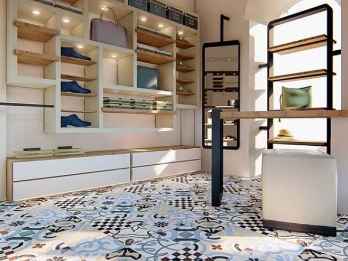 Archisio - Anna Passarelli - Progetto Legno ferro tinte calde espositori modulabili e un pavimento dal tocco vintage