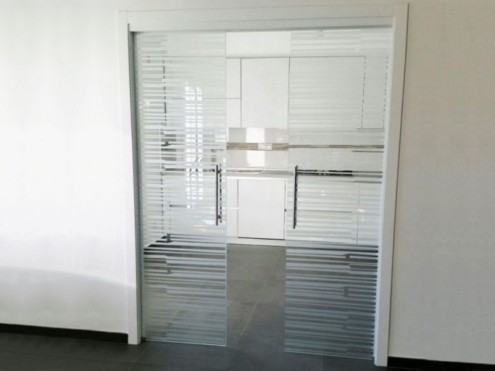 Archisio - Vetreria Kroton - Progetto Porte in vetro