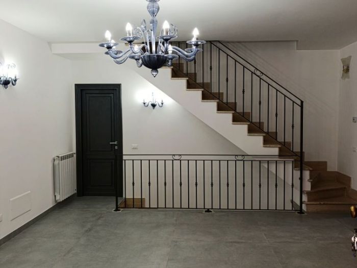 Archisio - Mani Srl Ristrutturazini - Progetto Ristrutturazione salone con parete attrezzata roma Zona axa casalpalocco