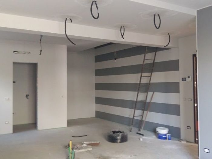 Archisio - A2 Architetti - Progetto Ristrutturazione a cremaDa cantina a soggiorno dominano le righe