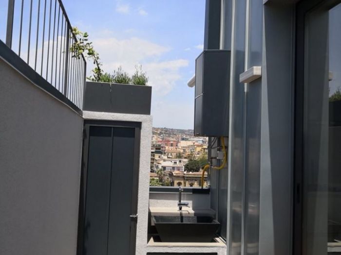 Archisio - Alfio Carmelo Lombardo - Progetto Structured attic with aluminum frames and glass titanium zinc cover