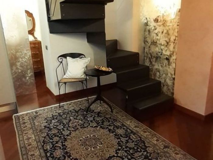 Archisio - Fiorella Balzarotti - Progetto Appartamento con soppalco a vista