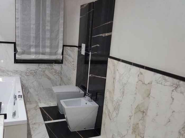Archisio - Calabra Marmi - Progetto Bagni