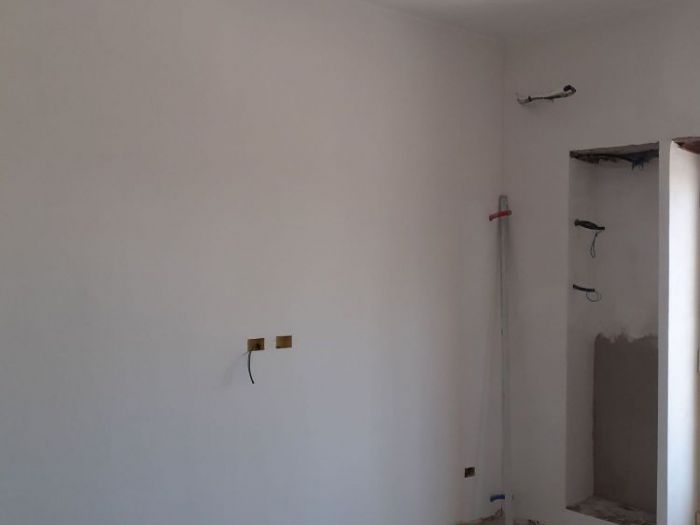 Archisio - Mani Srl Ristrutturazini - Progetto Realizzazione PrecedenteCamera da letto con armadio nascosto roma zona magliana