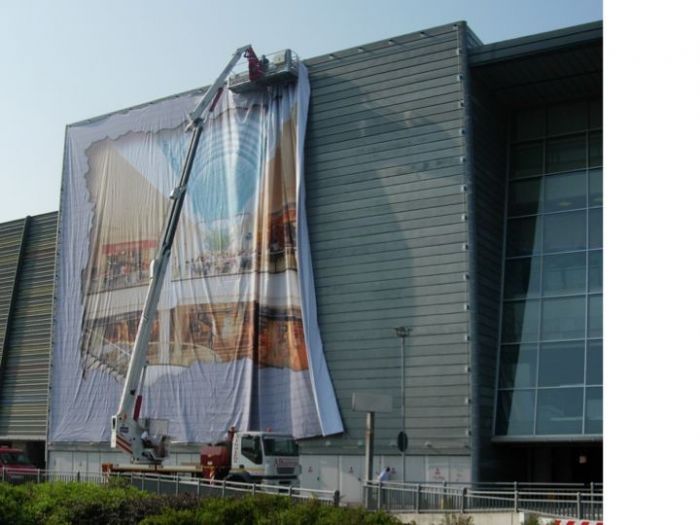 Archisio - Eurodigital Service - Progetto Istallazione maxi teli pvc orio center