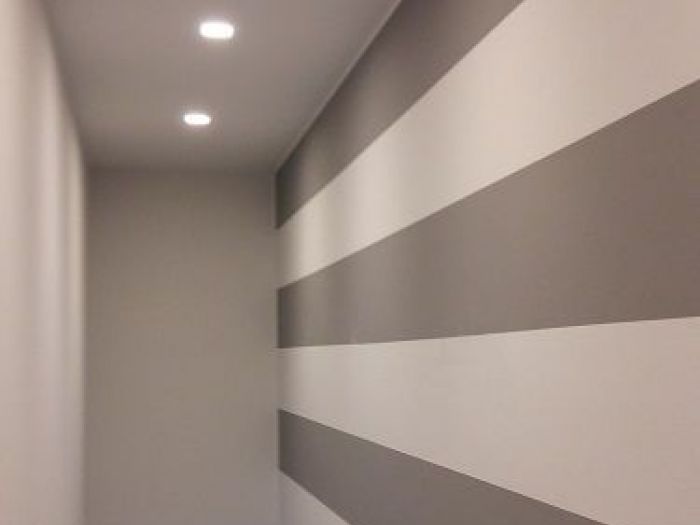 Archisio - A2 Architetti - Progetto Ristrutturazione a cremaDa cantina a soggiorno dominano le righe