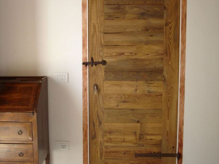 Archisio - Il Noce srl - Progetto Porte in legno di recupero