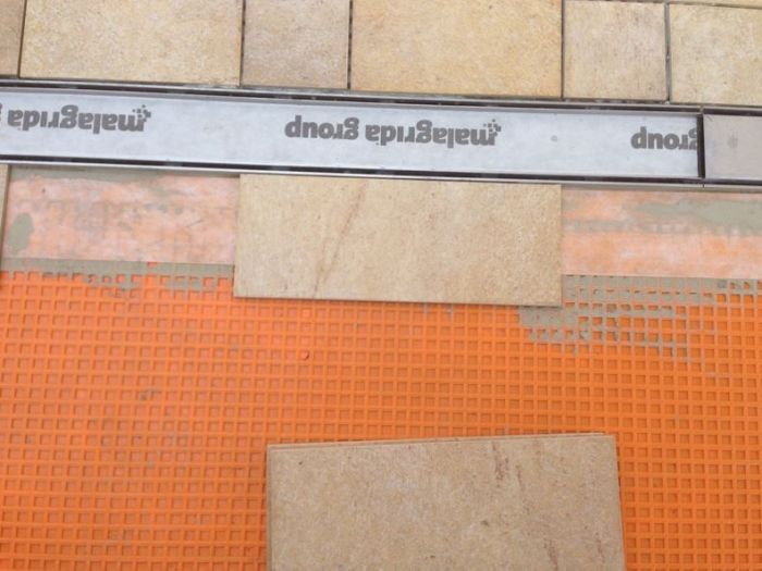 Archisio - Malagrida Group Srl Canalina Infinity - Progetto Cortile villetta