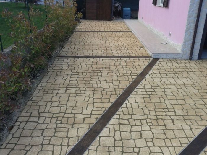 Archisio - Costruzioni Trivellato Di Mauro Trivellato C Snc - Progetto Intonaci stampati pavimentazioni esterne in deco spray pavimentazioni e rivestimenti in microcemento paratie a tenuta stagna rocce artificiali