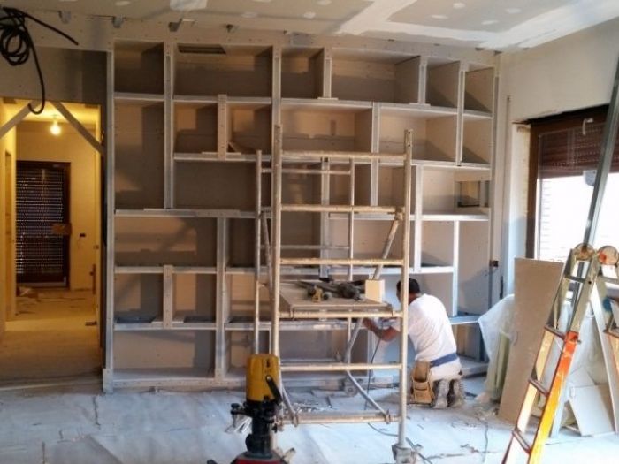 Archisio - Equilatero srl - Progetto Libreria curva in cartongesso