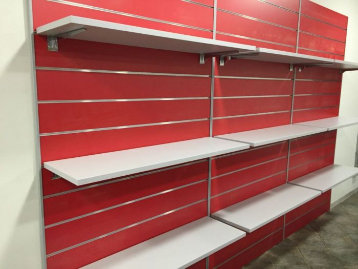 Archisio - Imetallici Di Taverna Andrea Taverna - Progetto Allestimento banchi e pannelli dogati locale commerciale