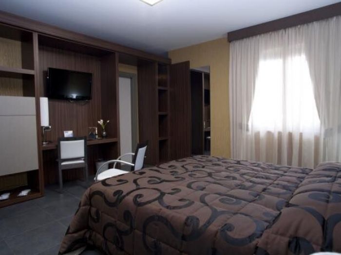 Archisio - Armonie Dinterni Sas - Progetto Letti divani e poltrone