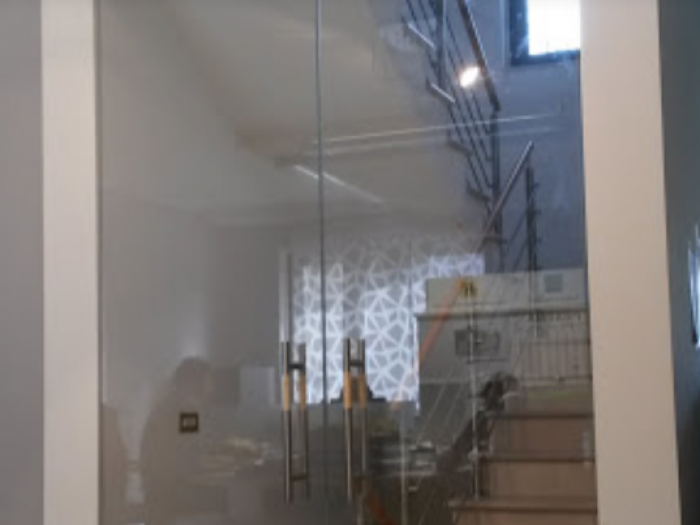 Archisio - Glass Center Mola - Progetto Porta in vetro