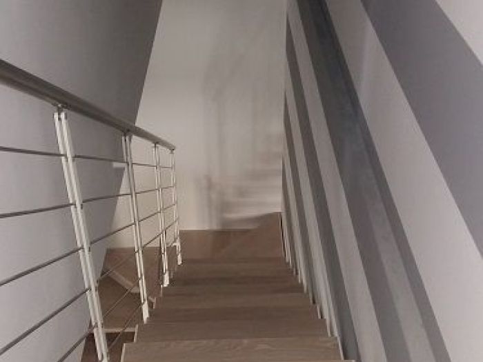 Archisio - A2 Architetti - Progetto Ristrutturazione a cremaDa cantina a soggiorno dominano le righe