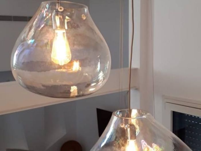 Archisio - Paola Illuminazione - Progetto Illuminare salone con soppalco