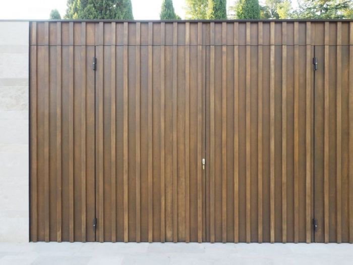 Archisio - Studio Lenzi Associati - Progetto Piscina e spogliatoio in pietra in collina