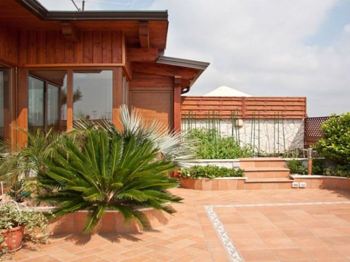 Archisio - Mario Pucciarelli - Progetto Mansarda e orto in citt