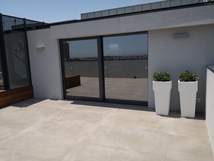 Archisio - Alfio Carmelo Lombardo - Progetto Structured attic with aluminum frames and glass titanium zinc cover