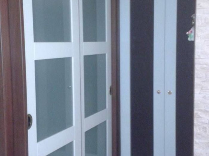 Archisio - Falegnameria Salvioli - Progetto Porta in legno scorrevole