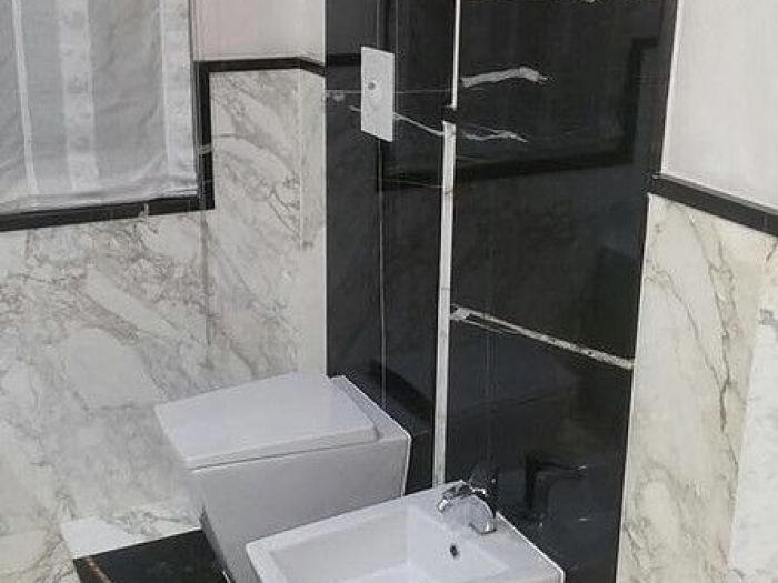 Archisio - Calabra Marmi - Progetto Bagni