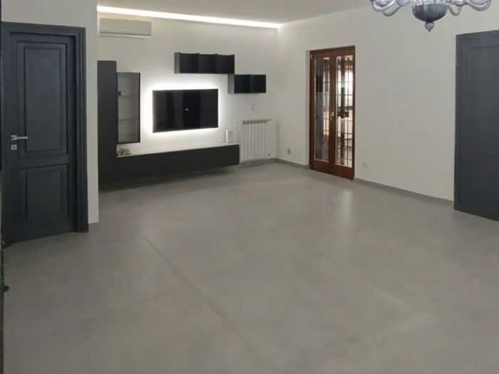 Archisio - Mani Srl Ristrutturazini - Progetto Ristrutturazione salone con parete attrezzata roma Zona axa casalpalocco