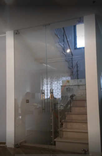 Archisio - Glass Center Mola - Progetto Porta in vetro