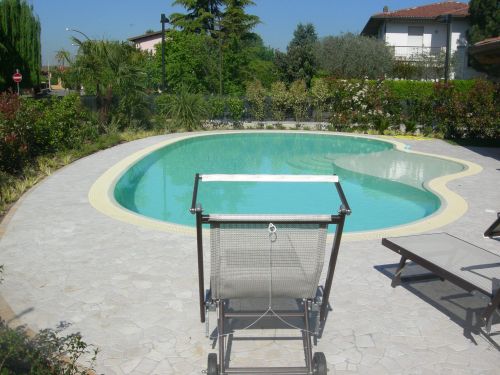 Archisio - Bertoli Piscine - Progetto Piscina sagomata a sfioro